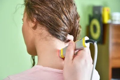 Laser therapy. Physical therapist treating patient neck